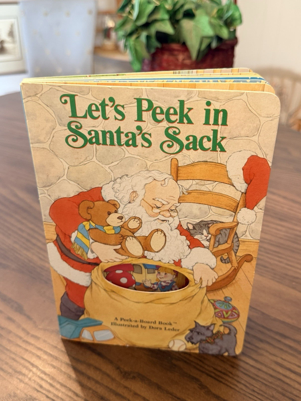Let’s Peek in Santa’s Sack Board Book 1990 Dora Leder Vintage Peek-a-Board Funny